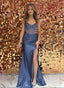 Girl in a corseted steel blue evening gown with a high slit perfect for prom or other occasion 