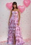 Woman in a pink floral dress with ruffles, Sherri Hill, Portia and Scarlett 