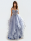 Woman wearing a light blue Ballgown with a white background