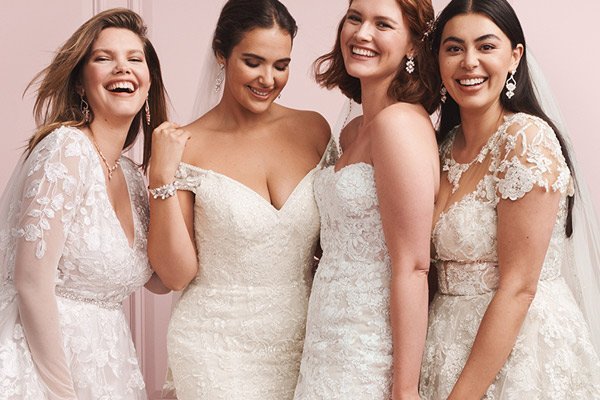 Group of teens posing in stylish gowns at a prom dress shop ideal for shoppers searching prom dresses near me.
