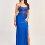 This royal blue prom dress has a corset bodice with elaborate beading and a satin skirt with a slit that goes up to the thighs and spaghetti straps. It's great for formal events. You can get it at Proms & Beyond.