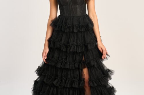 Showcasing 2025 formal fashion trends in satin with contemporary accents, this elegant black ball gown from the UK was worn on the red carpet.