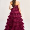 Model wears a beautiful pink prom gown with an open back, which contrasts perfectly with peach prom dresses for a romantic appearance.
